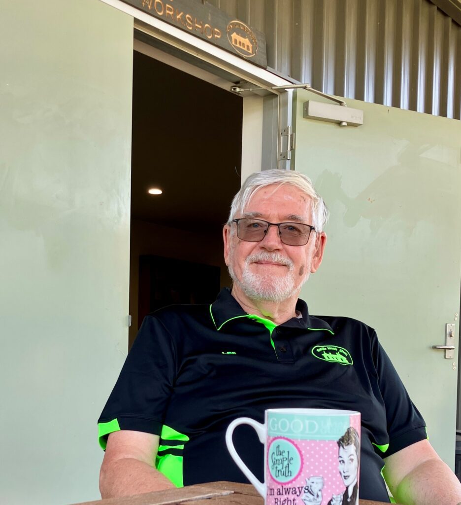 Les sitting at a table drinking a cuppa