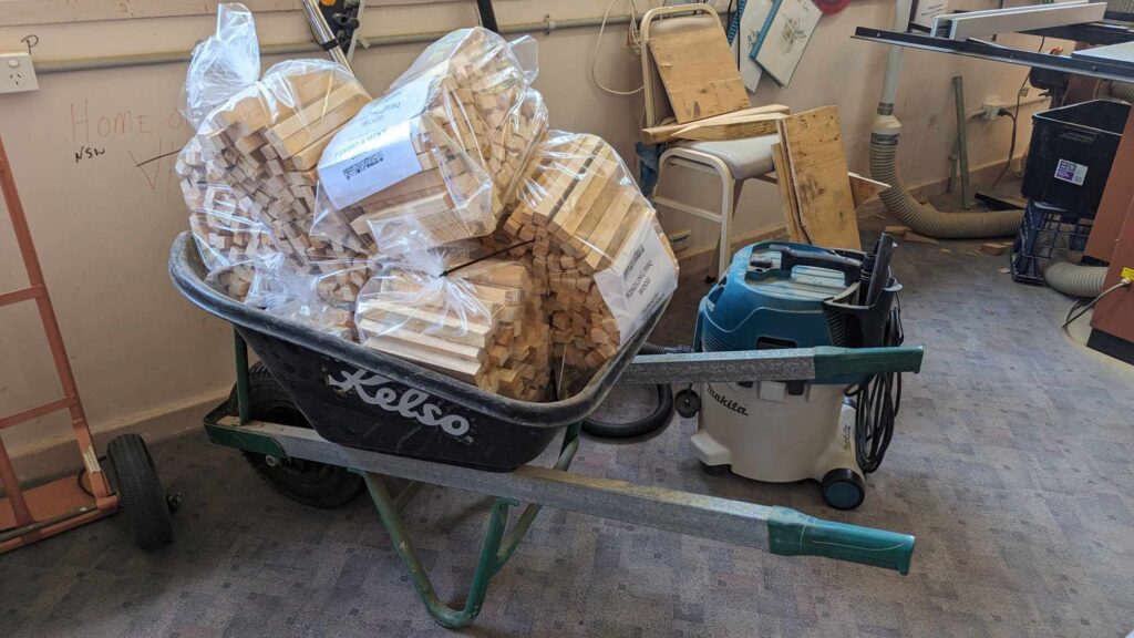  A wheelbarrow filled with Kindling ready for sale