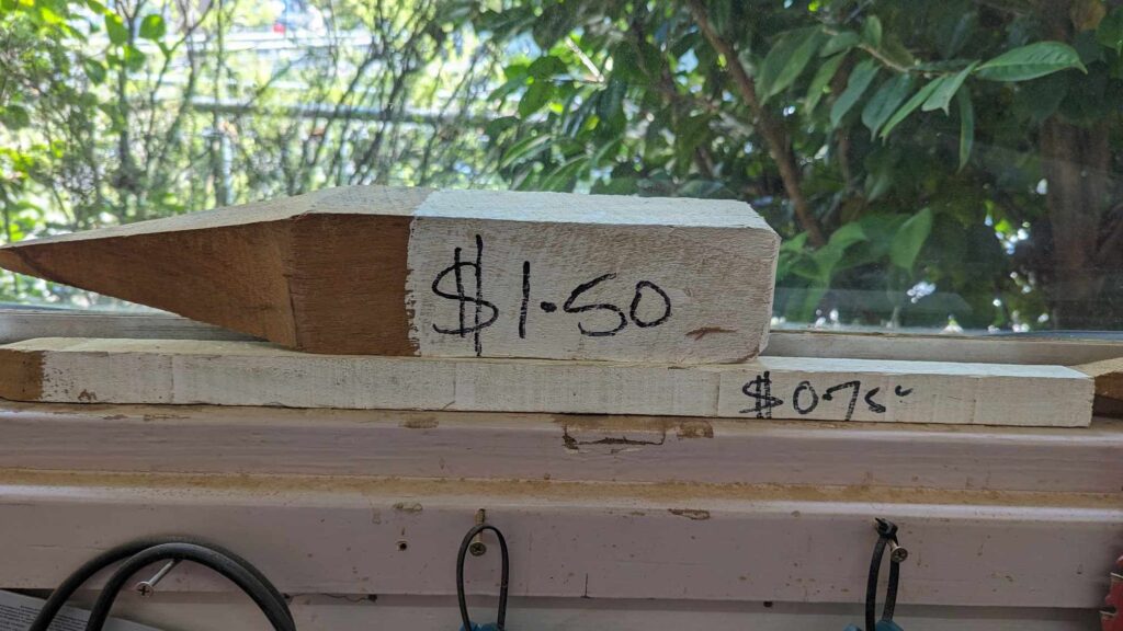 Surveyor pegs with prices marked on them 