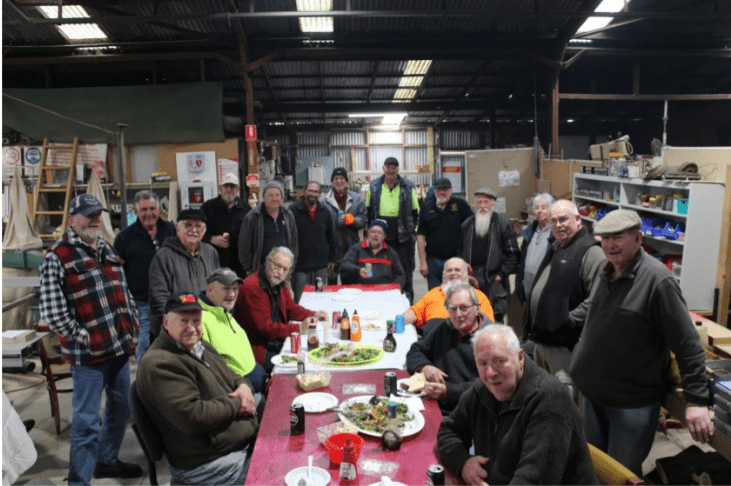 a group of men at a bbq