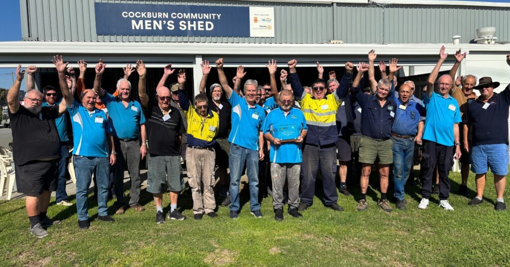 a photo of the members of Cockburn Mens shed outside the shed